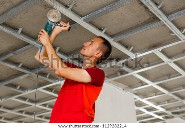 Construction Worker Assemble Suspended Ceiling Drywall Stock Photo