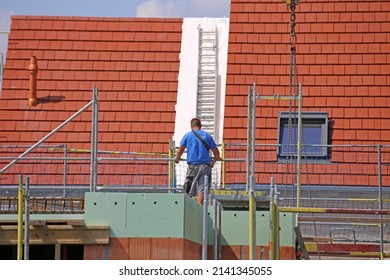 Construction Worker (bricklayer) Works On The Construction Site