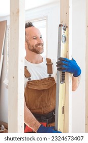 A Construction Worker Building renovation an old house