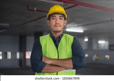 Construction Worker At Building Site. Portrait Of Contruction Worker.