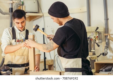 Construction Worker Building Timber Frame In New Home