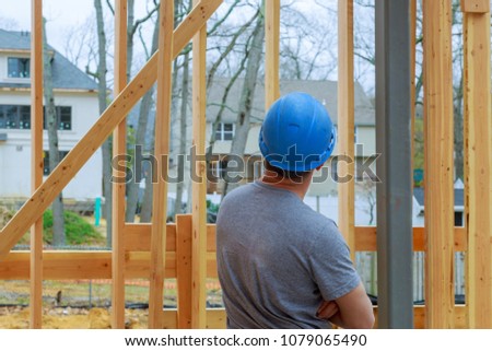 Construction Worker Building Timber Frame New Home