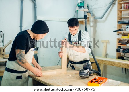 Construction Worker Building Timber Frame In New Home