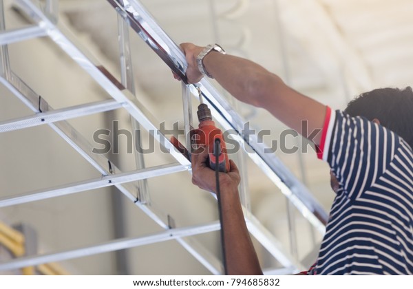 Construction Worker Ceiling Metal Frame Screwdriver Stock Photo