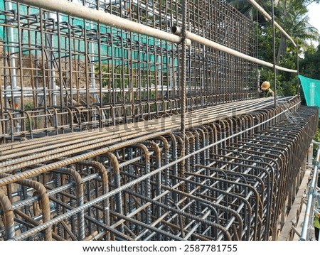 construction worker checking rebar of abutment bridge structure before pouring concrete