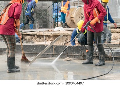 Construction Worker Concrete Floor Cleaning With High Pressure Water Jet