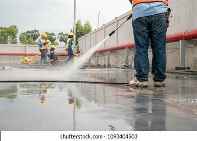 Construction Worker Concrete Floor Cleaning With High Pressure Water Jet