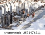 Construction worker Concrete pouring during commercial concreting floors of building in construction site and Civil Engineer or Construction engineer inspec work