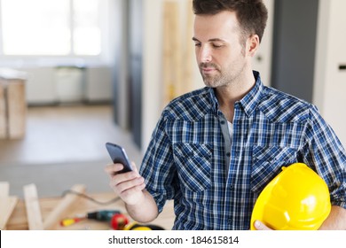 Construction Worker With Contemporary Mobile Phone 