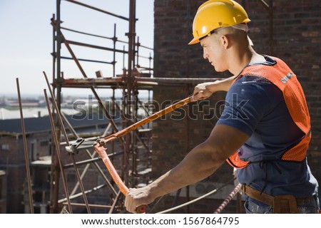 Similar – Image, Stock Photo The worker cuts the parquet on a circular saw