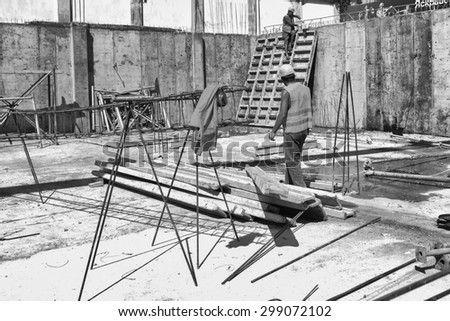 Construction, worker engaged in work on the rack.