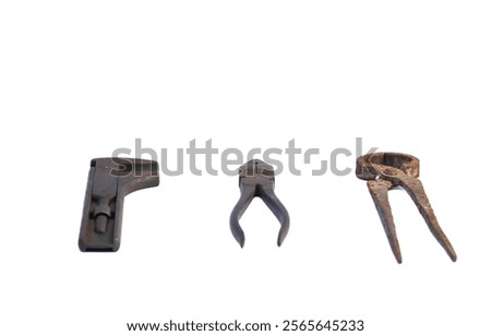 Construction worker equipment in the form of iron cutting pliers, monkey wrench, rusty wire pliers isolated on white background
