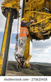 Construction worker fixing drilling pile foundation.