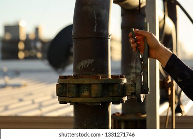 Construction Worker Hand Turning On Main Water Supply Valve Which Connecting To Cooling Tower Unit System Building Site, Sydney City, Australia  