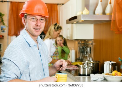 Construction Worker With Hardhat And Father Of A Family Having A Morning Cup Of Coffee Before Heading For His Workplace