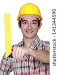 Construction worker holding a try square