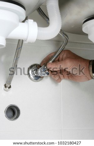 Construction worker installing a kitchen sink
