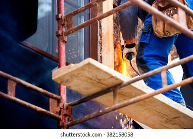 Construction Worker Insulating House With Glass Wool, Close Up