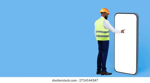 Construction Worker Interacting With a Large Smartphone on a Blue Background
