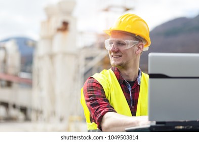 Construction worker with laptop - Powered by Shutterstock