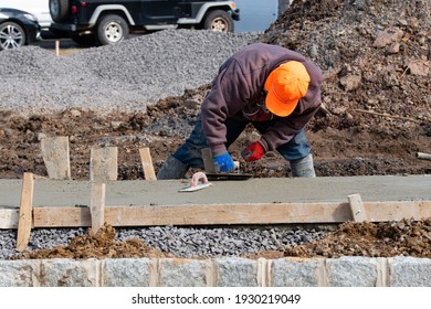 Construction Worker Leveling Concrete Pavement Outdoors Man Hard Work