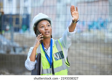 Construction Worker, Maintenance And Development Woman Multitask On A Phone While Working. Building Management Employee On A Work Call Helping Holding Up A Hand On A Contractor And Builder Job Site