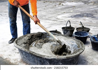 Construction Worker Mixing Cement