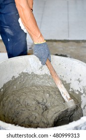 Construction Worker Mixing Cement