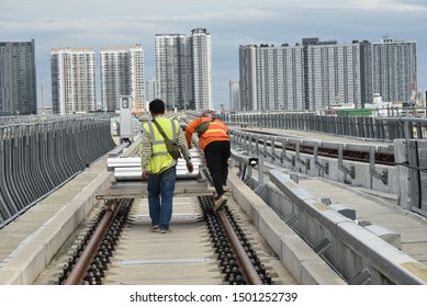 Construction Worker  Move Equipment Material Railway On The Track.team Labour Man Bring Concrete Work On Railroad Transportation Machine Of Infastructure  In City.