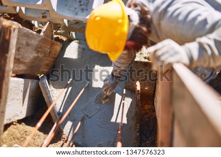 Construction worker on a heavy site doing hard work.