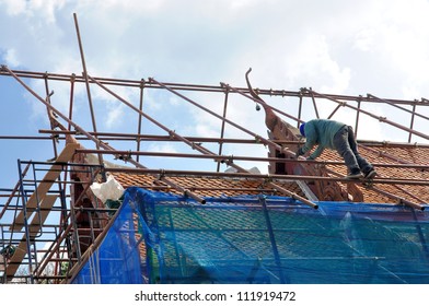 A Construction Worker On A High Roof Show Risk Concept