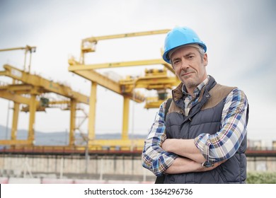 Construction Worker On Industrial Sight Looking At Camera