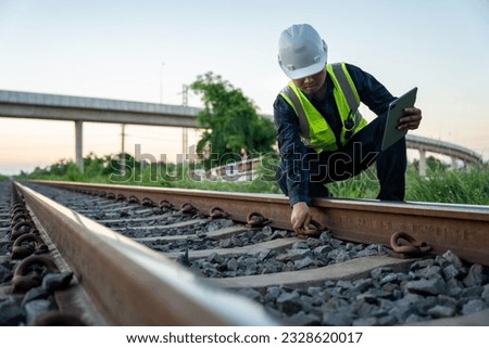 A construction worker on railways. Engineer work on railway. Infrastructure.