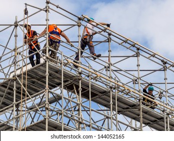 construction worker on a scaffold, symbolfoto for building, construction boom, labor protection - Shutterstock ID 144052165