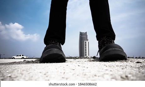 A construction worker with safety boot.
