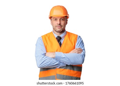 Construction Worker. Serious Builder Man Posing Crossing Hands Looking At Camera Standing Over White Background. Studio Shot