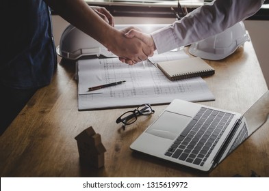 Construction Worker Shaking Hands With Customer After Finishing Up Business Meeting To Start Up Project Contract In Office Center At Construction Site, Home Loan, Contractor, Engineering Concept