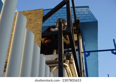 construction worker at a construction site welding