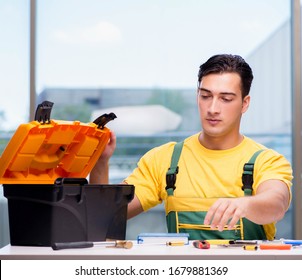 Construction worker sitting at the desk