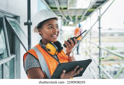 Construction worker with tablet, walkie talkie or radio talking, instructing and checking building progress on development site. Architect manager, female leader or engineer watching infrastructure