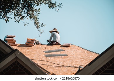 A Construction Worker Taking A Short Break From The Long, Tough Construction Job.