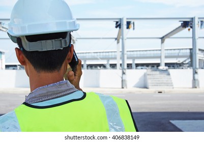 construction worker talking on the phone. view from the back. 