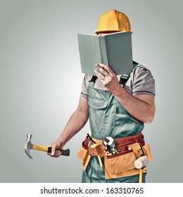 construction worker with a tool belt and book