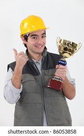 Construction worker with trophy