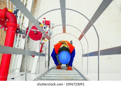 A Construction Worker Use Fire Escape