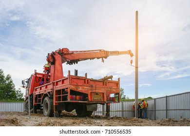 Construction Worker Use Truck With Crane Election Electric Power In Construction Site Inspec By Safety Officer 