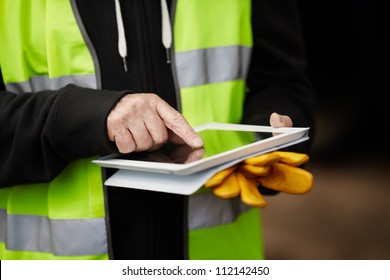 construction worker using digital tablet