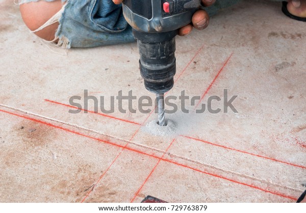 Construction Worker Using Electronic Drill Make Royalty Free