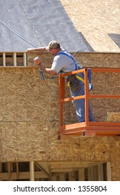Construction Worker Using Nail Gun Stock Photo 1355804 | Shutterstock