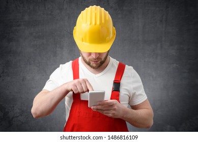 A construction worker using smartphone